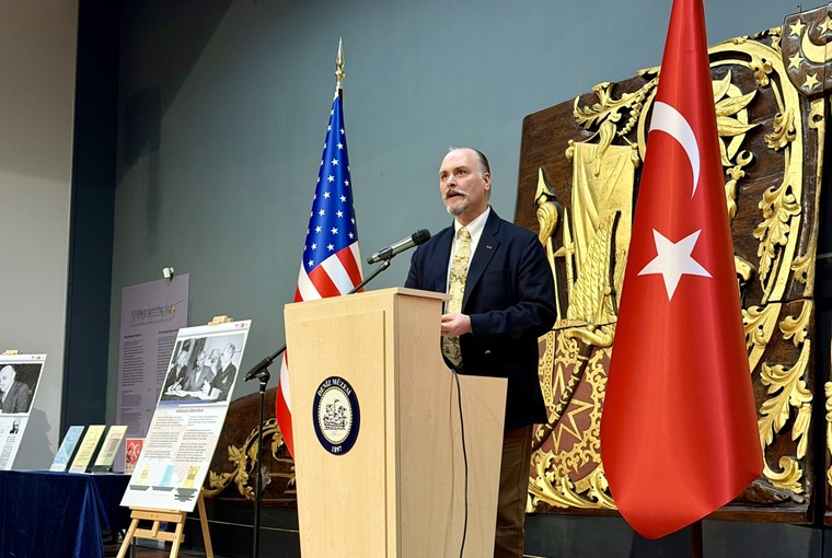 A man speaking at a podium